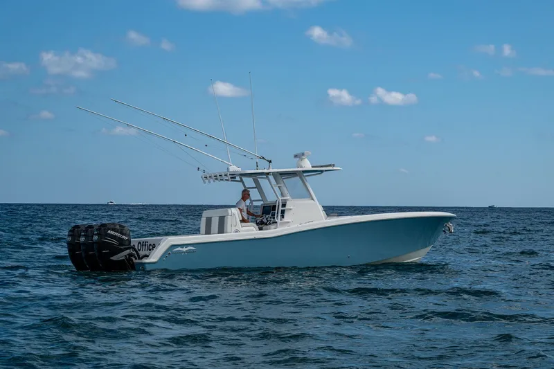 Slide: The Image of 2023 Invincible 36 Open Fisherman boat on open water, clear sky background. - 63