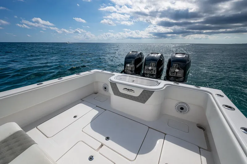 Slide: The Image of 2023 Invincible 36 Open Fisherman boat with triple engines on open sea. - 66