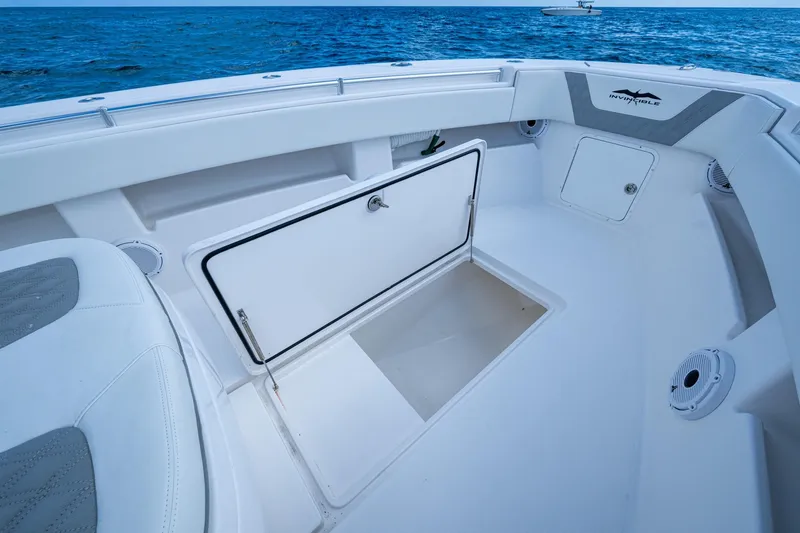 Slide: The Image of 2023 Invincible 36 Open Fisherman boat interior with storage compartment open. - 67
