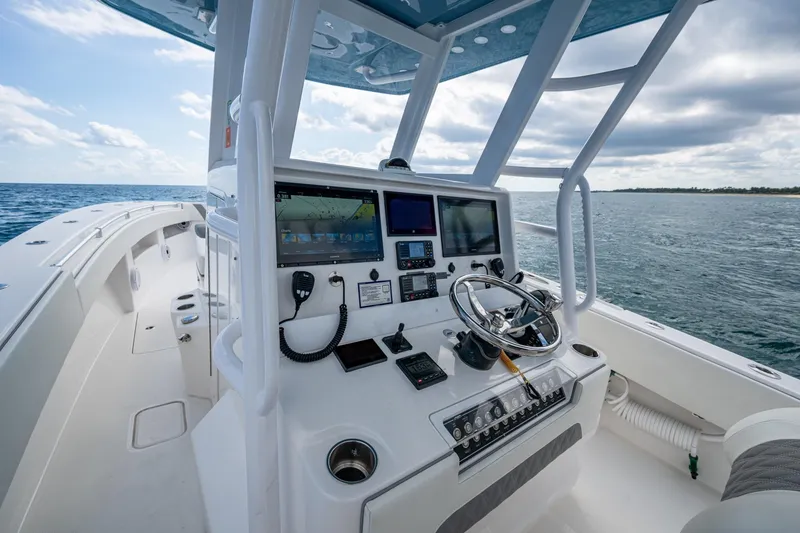 Slide: The Image of 2023 Invincible 36 Open Fisherman boat dashboard with ocean view. - 71