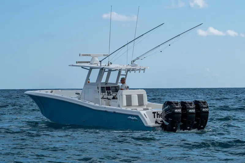 Slide: The Image of 2023 Invincible 36 Open Fisherman boat with triple Mercury engines on the ocean. - 74