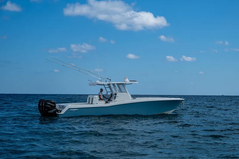 Slide: The Image of 2023 Invincible 36 Open Fisherman boat on open sea under blue sky. - 77