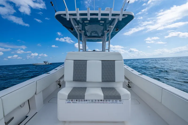 Slide: The Image of 2023 Invincible 36 Open Fisherman boat on open sea under blue sky. - 78