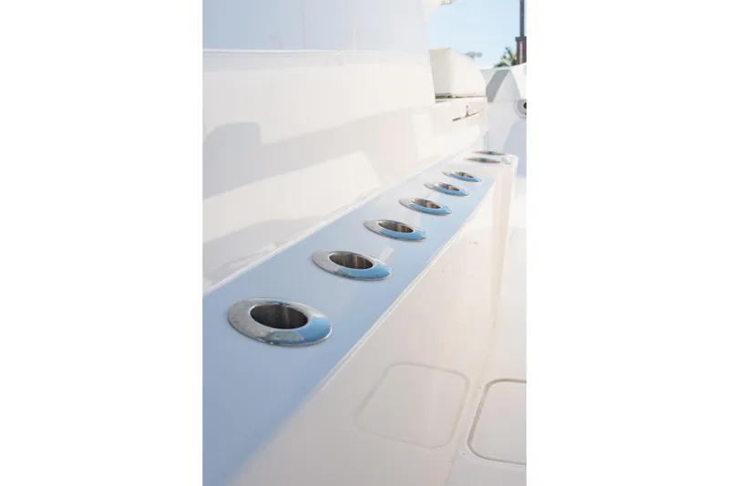 Slide: The Image of 2023 Invincible 36 Open Fisherman boat interior with open hatch and visible engine components. - 8