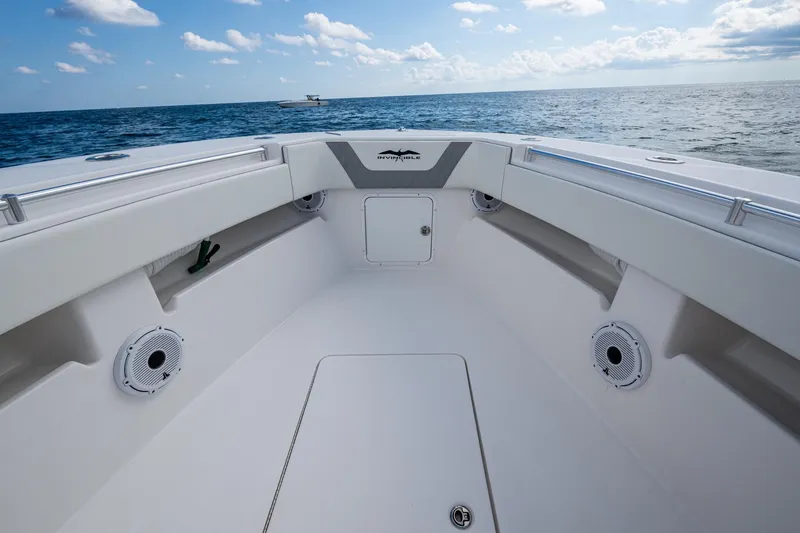 Slide: The Image of 2023 Invincible 36 Open Fisherman boat interior with ocean view, featuring sleek design and speakers. - 81