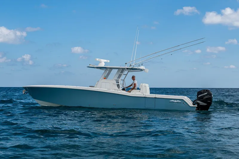 Slide: The Image of 2023 Invincible 36 Open Fisherman boat on open sea under blue sky. - 83