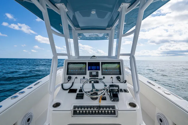 Slide: The Image of 2023 Invincible 36 Open Fisherman boat dashboard with ocean view. - 85