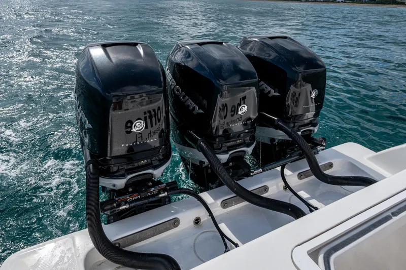 Slide: The Image of Triple Mercury outboard engines on 2023 Invincible 36 Open Fisherman boat in ocean. - 87