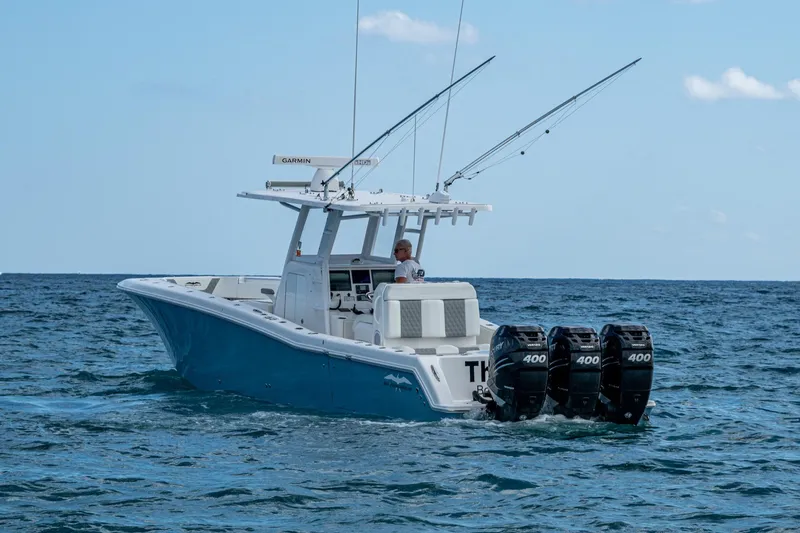 Slide: The Image of 2023 Invincible 36 Open Fisherman boat with triple 400 engines on the ocean. - 88