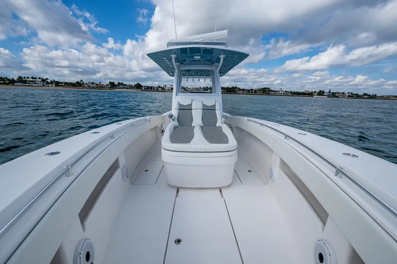 Slide: The Image of 2023 Invincible 36 Open Fisherman boat on calm waters under a cloudy sky. - 92
