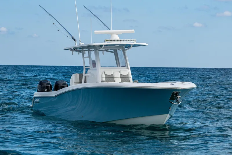 Slide: The Image of 2023 Invincible 36 Open Fisherman boat on open sea, featuring dual engines. - 94