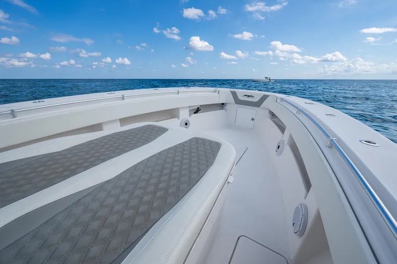 Slide: The Image of 2023 Invincible 36 Open Fisherman boat on open sea under blue sky. - 95