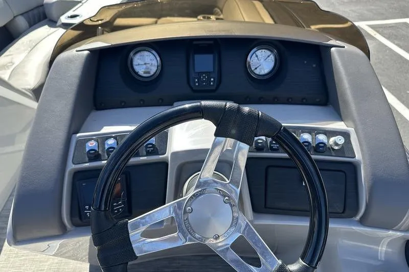 Slide: The Image of Steering console of 2021 Bennington 24 RTFB boat with gauges and controls. - 19