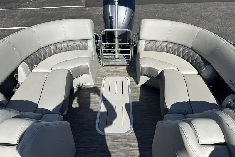 Slide: The Image of 2021 Bennington 24 RTFB pontoon boat interior with gray seating and flooring. - 20
