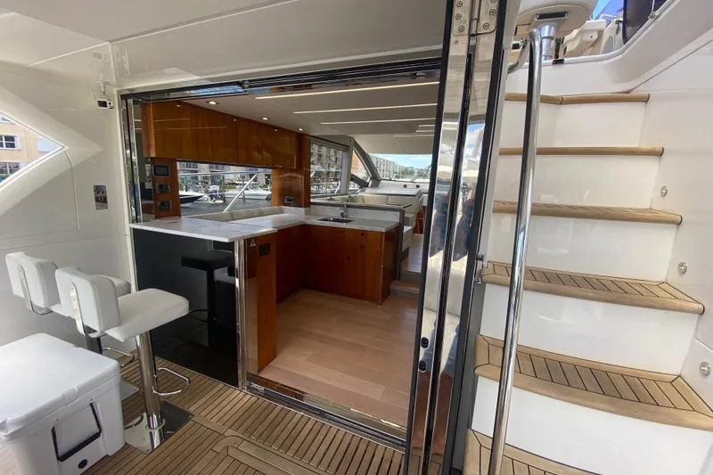 Slide: The Image of Luxurious interior of 2017 Sunseeker Manhattan 52 yacht with modern kitchen and seating area. - 15