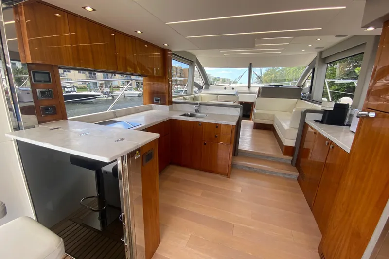 Slide: The Image of Luxurious interior of 2017 Sunseeker Manhattan 52 yacht with modern kitchen and seating area. - 16