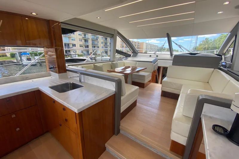 Slide: The Image of Luxurious interior of 2017 Sunseeker Manhattan 52 yacht with modern kitchen and seating area. - 18