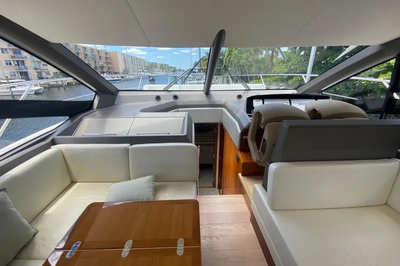 Slide: The Image of Luxurious interior of 2017 Sunseeker Manhattan 52 yacht with elegant seating and helm. - 19