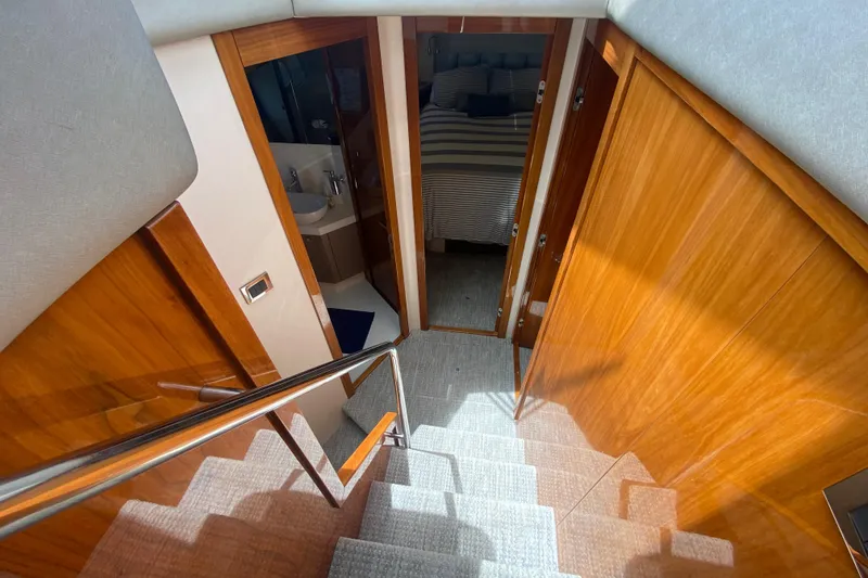 Slide: The Image of Interior view of 2017 Sunseeker Manhattan 52 yacht, featuring wooden stairs and cabin access. - 20
