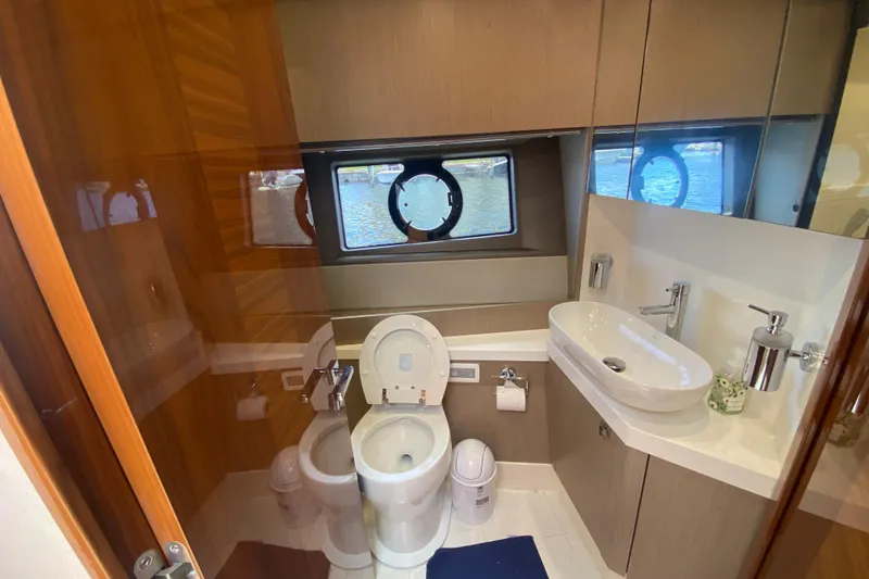 Slide: The Image of Luxurious bathroom in 2017 Sunseeker Manhattan 52 yacht with modern fixtures and ocean view. - 22