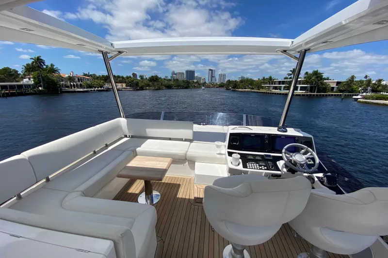Slide: The Image of Luxurious 2017 Sunseeker Manhattan 52 yacht interior with scenic waterfront view. - 6