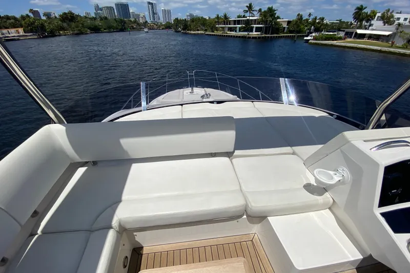 Slide: The Image of Luxurious 2017 Sunseeker Manhattan 52 yacht with spacious deck and waterfront view. - 8
