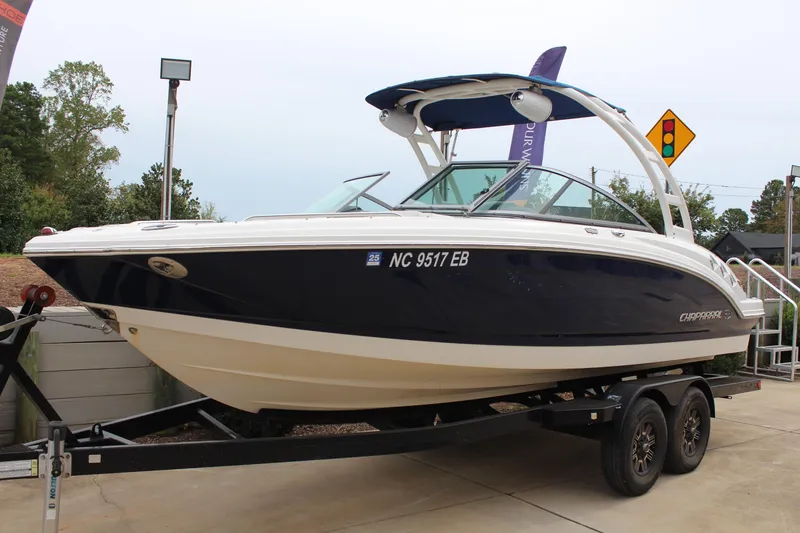 Slide: The Image of 2015 Chaparral 226 SSi boat on trailer, displayed outdoors. - 1