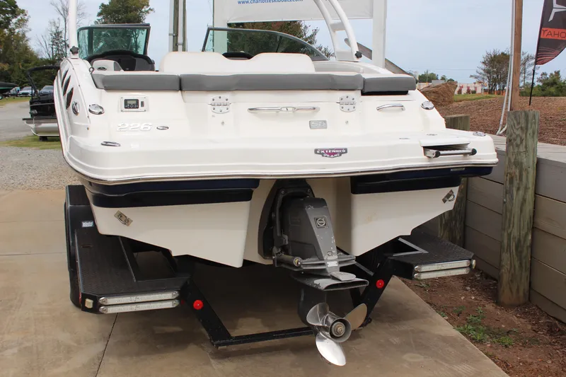 Slide: The Image of 2015 Chaparral 226 SSi boat on trailer, rear view showing propeller and swim platform. - 3