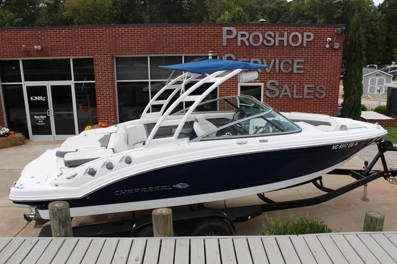 Slide: The Image of 2015 Chaparral 226 SSi boat on trailer outside service shop. - 5