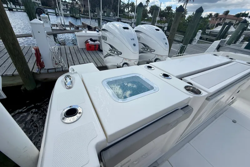 Slide: The Image of 2023 Pursuit S 358 Sport boat with Yamaha engines docked at marina. - 11