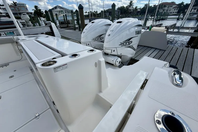 Slide: The Image of 2023 Pursuit S 358 Sport boat with Yamaha XTO engines docked at marina. - 12
