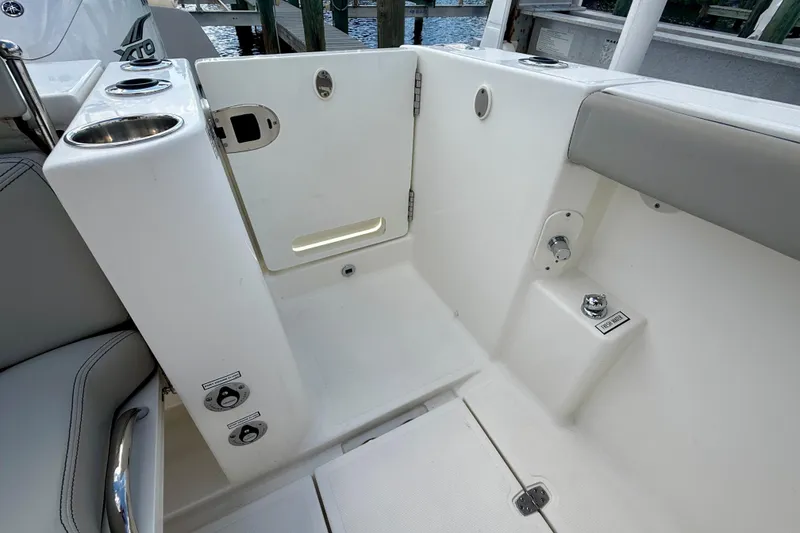 Slide: The Image of 2023 Pursuit S 358 Sport boat interior with seating and storage area. - 18