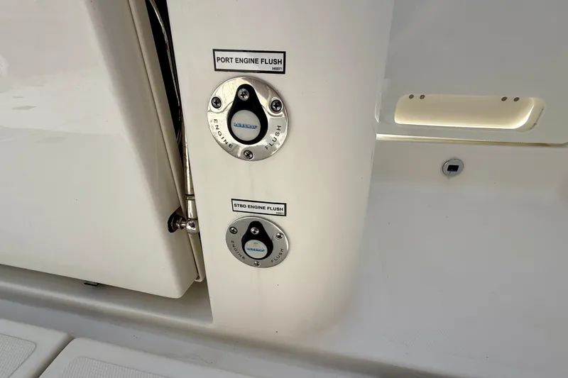 Slide: The Image of 2023 Pursuit S 358 Sport boat engine flush controls. - 22