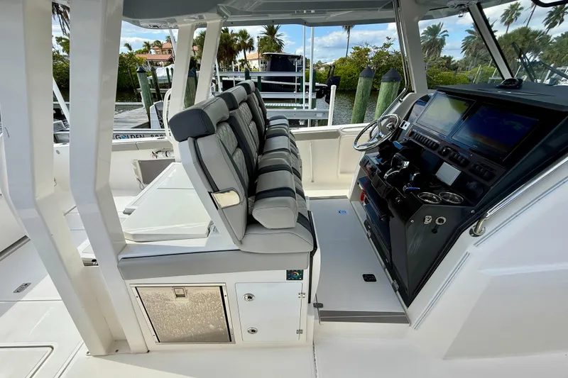 Slide: The Image of 2023 Pursuit S 358 Sport boat interior with modern helm and seating. - 30