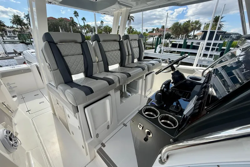 Slide: The Image of 2023 Pursuit S 358 Sport boat interior with luxury seating and modern helm controls. - 34