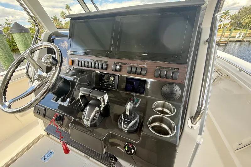 Slide: The Image of 2023 Pursuit S 358 Sport helm with dual screens and controls. - 40