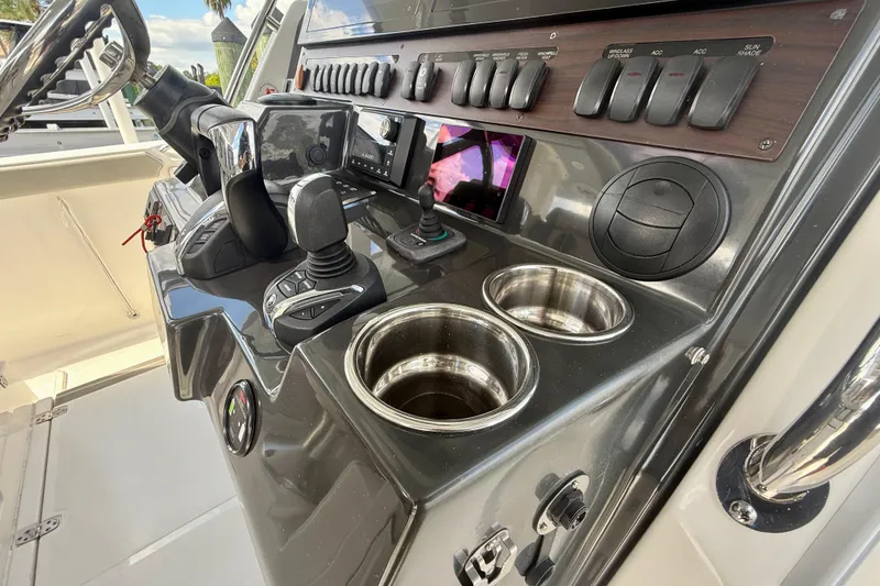 Slide: The Image of Control panel of 2023 Pursuit S 358 Sport boat with modern navigation equipment. - 41