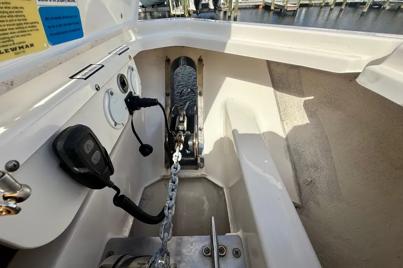 Slide: The Image of 2023 Pursuit S 358 Sport boat anchor chain and control panel detail. - 55
