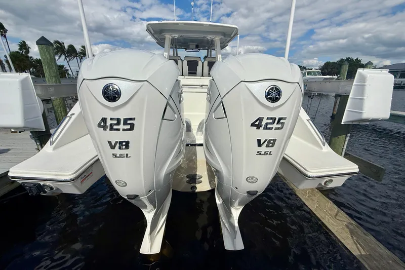 Slide: The Image of 2023 Pursuit S 358 Sport boat with twin 425 V8 engines docked. - 7