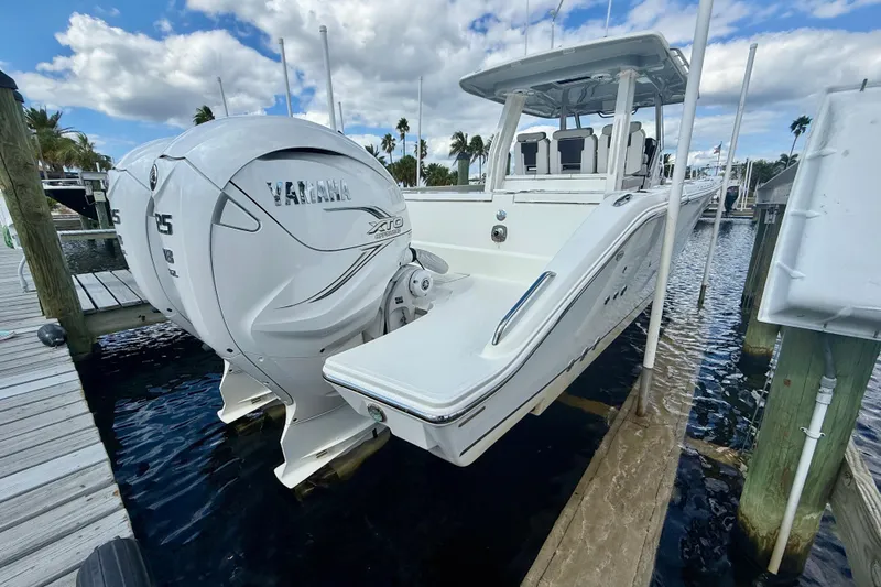 Slide: The Image of 2023 Pursuit S 358 Sport boat with Yamaha engines docked at marina. - 9