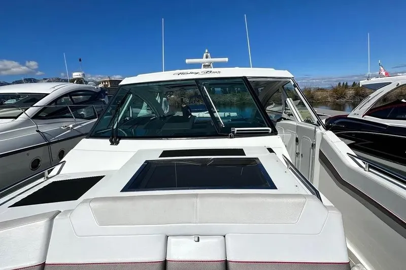 Slide: The Image of 2019 Formula 430 Super Sport Crossover yacht docked under clear blue sky. - 10
