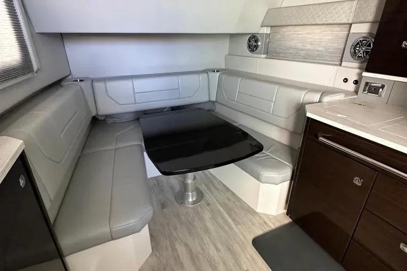 Slide: The Image of 2019 Formula 430 Super Sport Crossover interior with sleek seating and modern table design. - 4