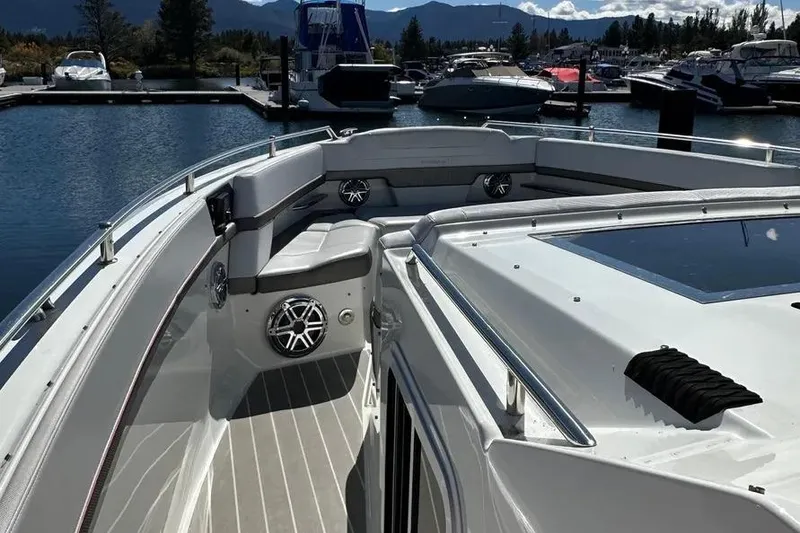 Slide: The Image of 2019 Formula 430 Super Sport Crossover boat docked at marina, featuring sleek design and spacious seating. - 9
