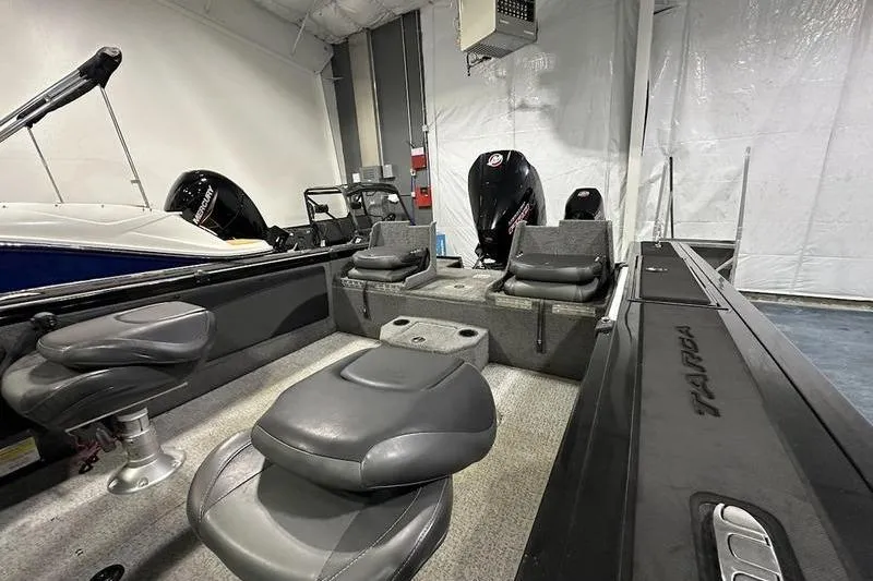 Slide: The Image of 2022 Tracker Targa V-19 Combo boat interior with steering wheel and seats. - 3