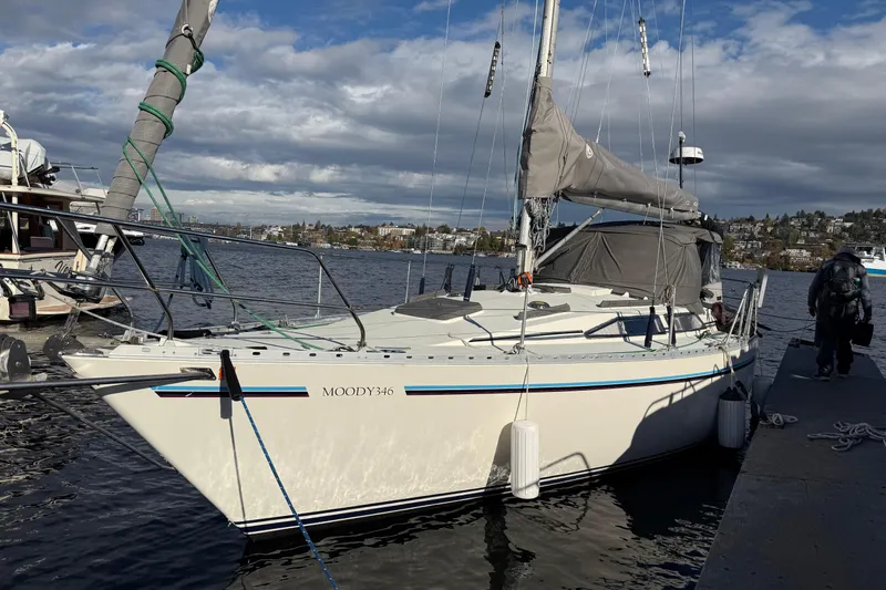 The Image of 1987 Moody 346 sailboat docked on a sunny day with scenic waterfront views. - 0