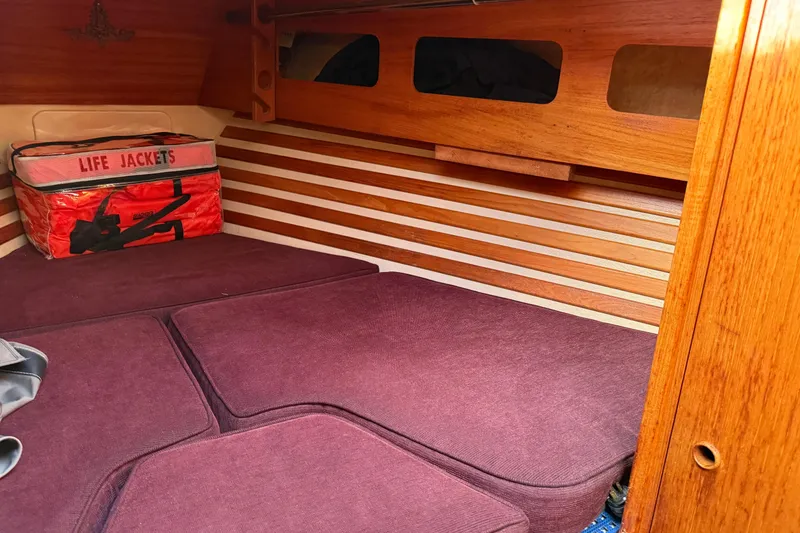 Slide: The Image of Cozy cabin interior of 1987 Moody 346 sailboat with life jackets stored. - 17
