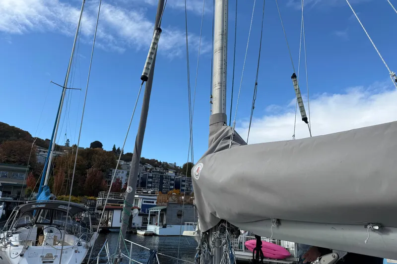 Slide: The Image of Sailboat Moody 346, 1987 model, docked with clear blue sky background. - 23