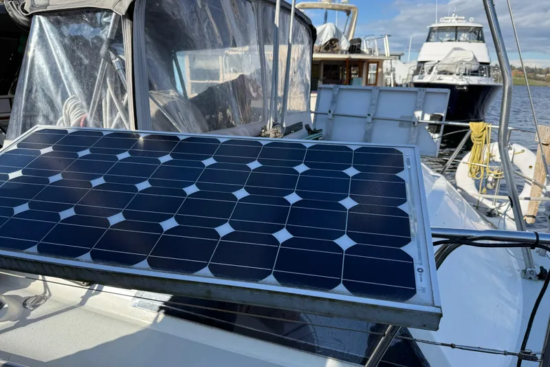Slide: The Image of Solar panel on 1987 Moody 346 yacht deck, docked with other boats in background. - 26