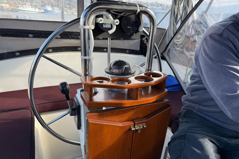 Slide: The Image of Cockpit of 1987 Moody 346 sailboat with wooden helm and steering wheel. - 5