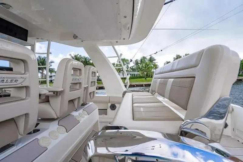 Slide: The Image of 2022 Boston Whaler 420 Outrage interior with luxurious seating and modern design. - 27